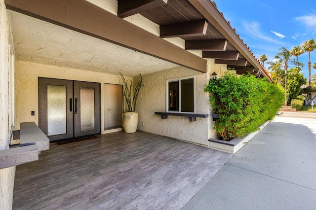 entrance to property featuring french doors