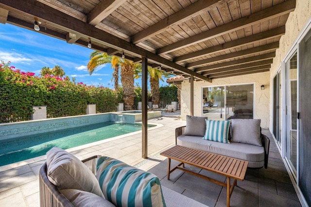 view of patio / terrace featuring a pool with hot tub and an outdoor living space