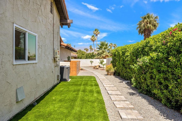 view of yard featuring central AC