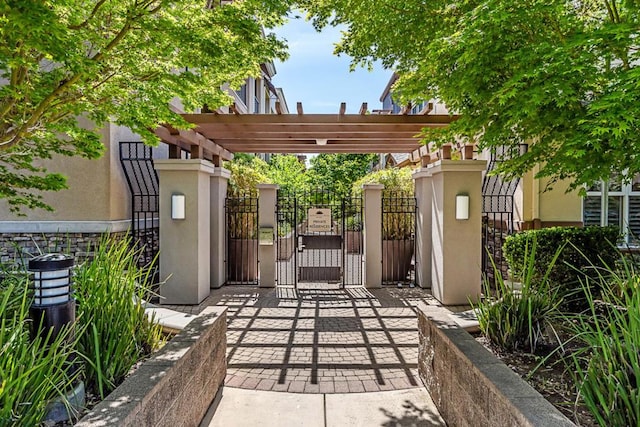 view of gate featuring a pergola