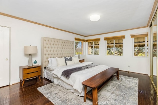 bedroom featuring ornamental molding and dark hardwood / wood-style floors