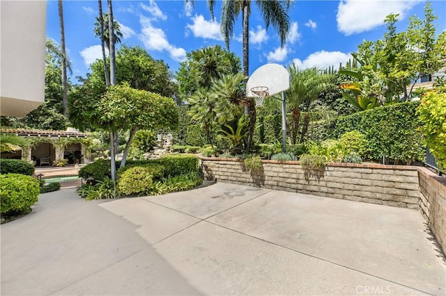 view of patio / terrace featuring basketball hoop