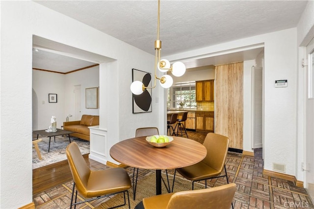 dining room featuring a textured ceiling