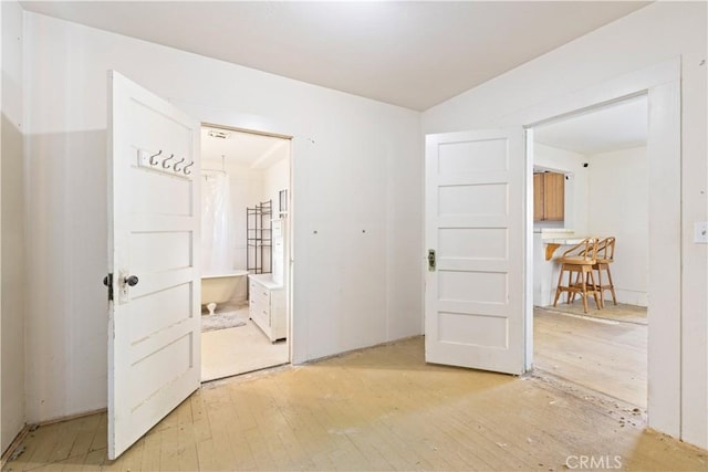 empty room with light hardwood / wood-style floors