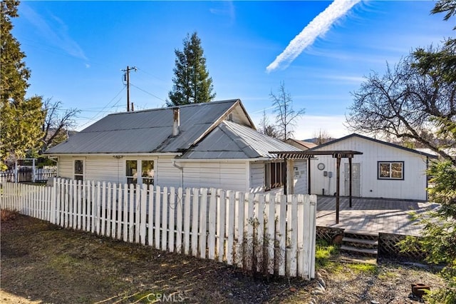 view of front of property with a wooden deck