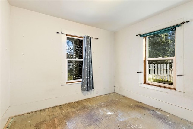 spare room with hardwood / wood-style flooring