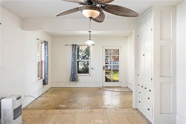 unfurnished dining area with ceiling fan, light hardwood / wood-style flooring, and plenty of natural light