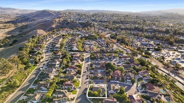 birds eye view of property featuring a mountain view