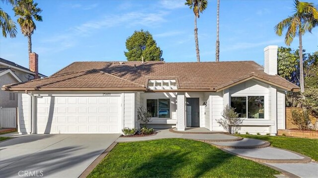 view of front facade with a front lawn and a garage