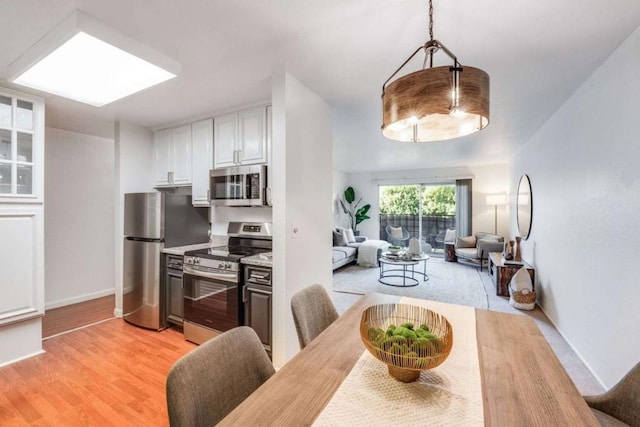 dining room featuring light hardwood / wood-style floors