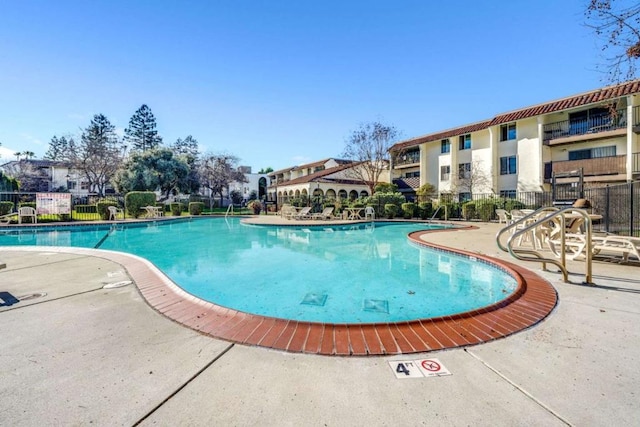 view of swimming pool featuring a patio