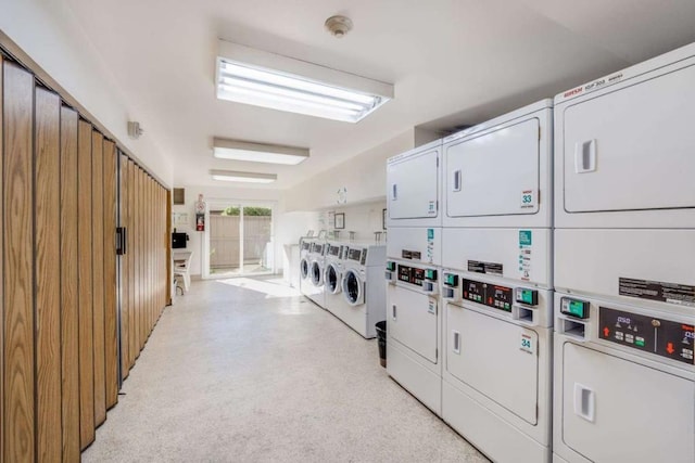 laundry area featuring washing machine and clothes dryer and stacked washer and dryer