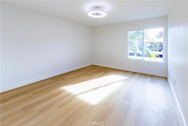 unfurnished room featuring light hardwood / wood-style floors