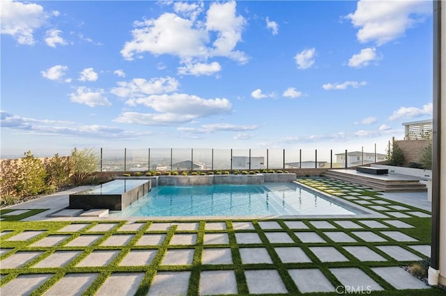 view of swimming pool featuring a patio area