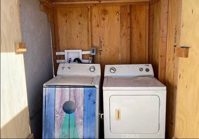 laundry area with independent washer and dryer