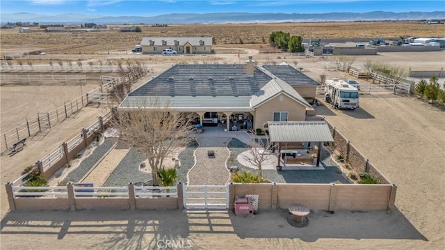 birds eye view of property with a mountain view