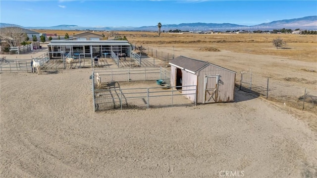 exterior space with a mountain view and a rural view