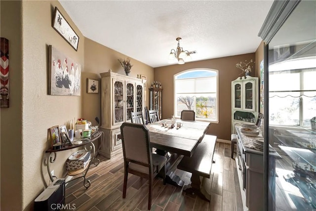 dining space featuring an inviting chandelier