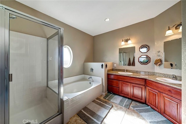 bathroom with vanity, independent shower and bath, and tile patterned flooring