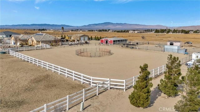 drone / aerial view featuring a rural view and a mountain view