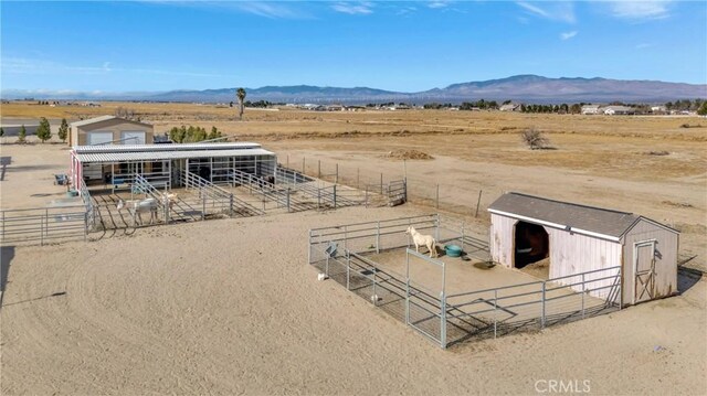 birds eye view of property with a rural view and a mountain view