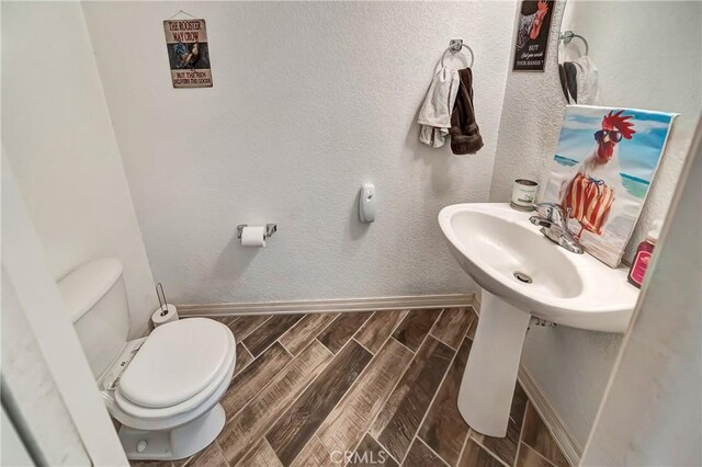 bathroom featuring toilet