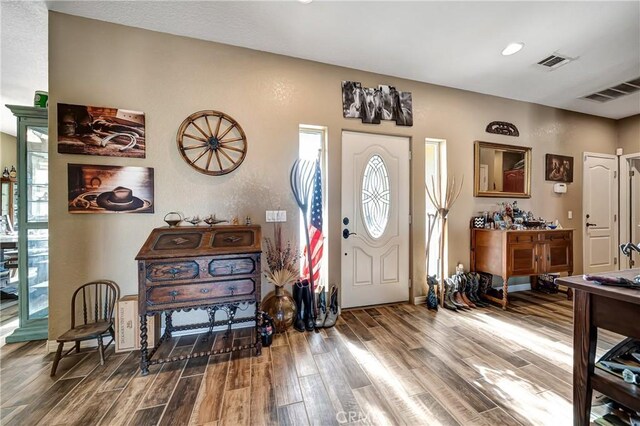 foyer entrance with hardwood / wood-style floors