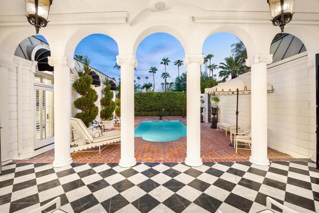 view of swimming pool featuring a patio area