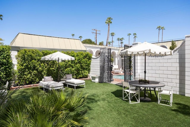 view of yard with a fenced in pool