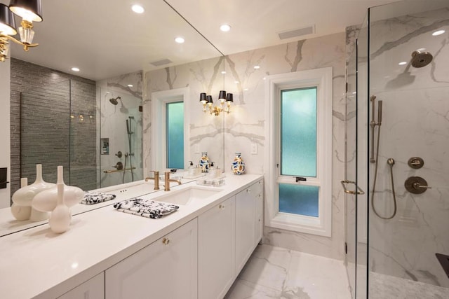 bathroom with walk in shower and vanity