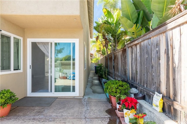 entrance to property featuring a patio