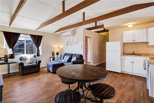 living room featuring sink, vaulted ceiling with beams, and a wall mounted air conditioner