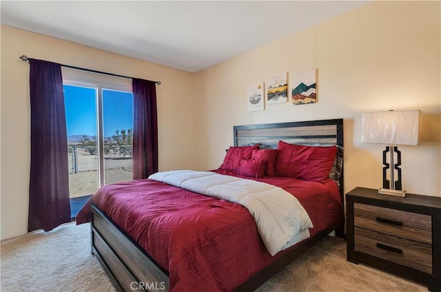 bedroom with access to outside and carpet flooring