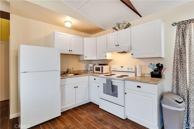 kitchen featuring lofted ceiling, sink, white cabinets, and white appliances