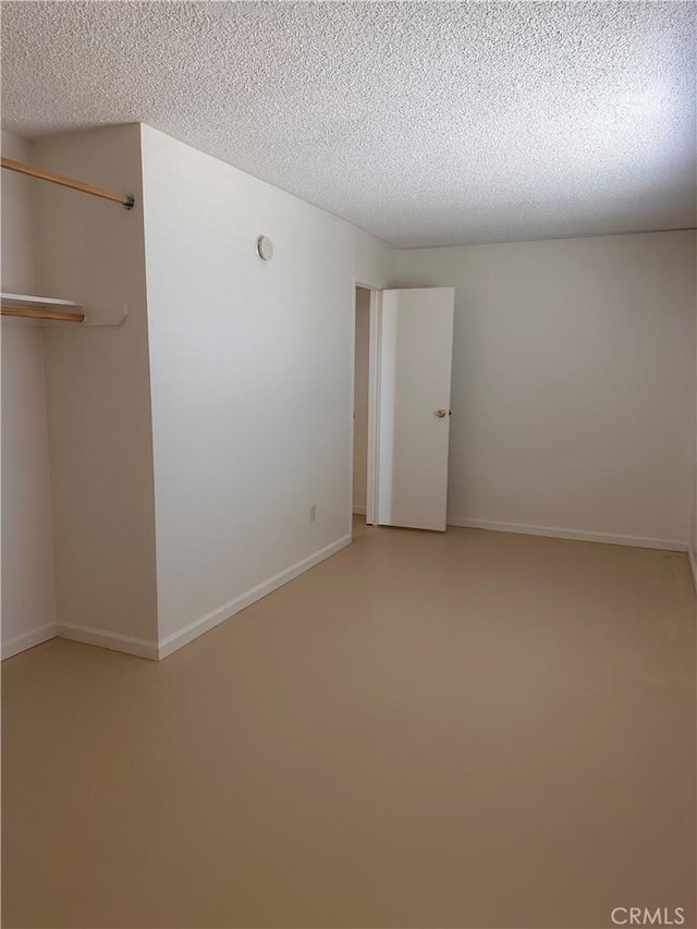 spare room featuring a textured ceiling