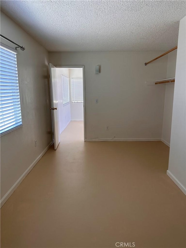 spare room featuring a textured ceiling