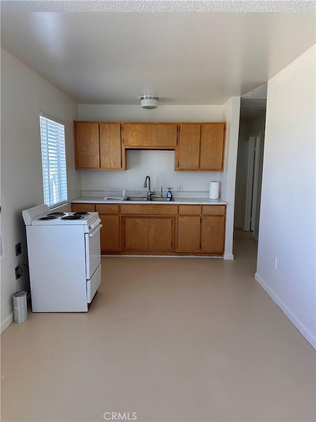 kitchen with sink and white stove