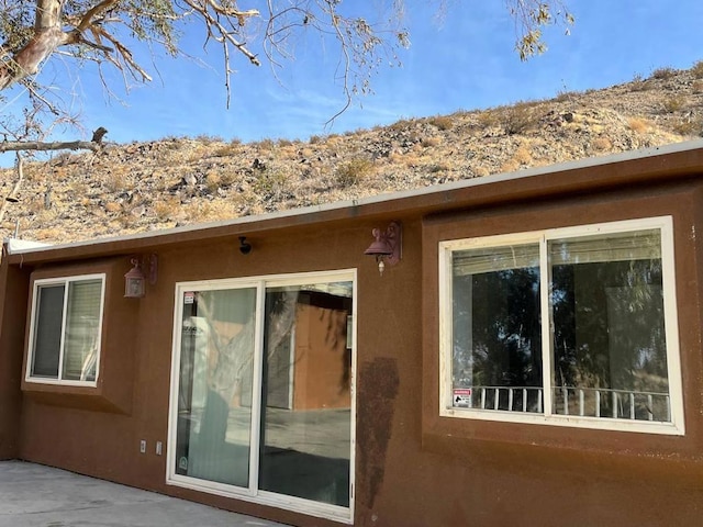 view of side of property featuring a patio area