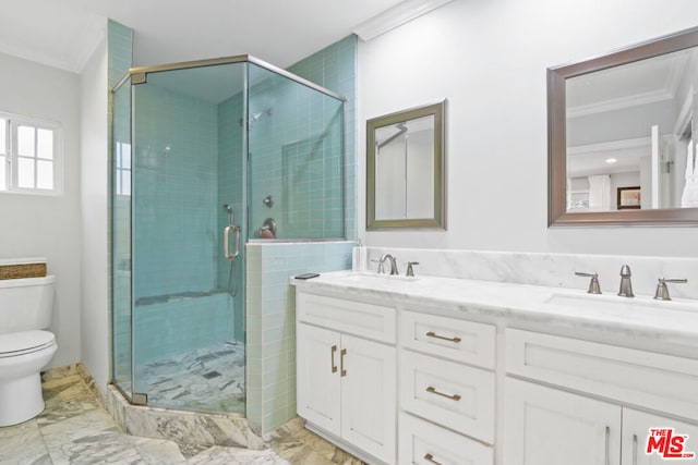 bathroom featuring a shower with door, vanity, crown molding, and toilet