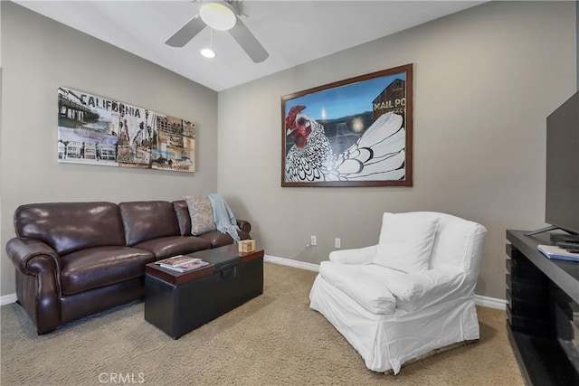 living room with ceiling fan and carpet flooring