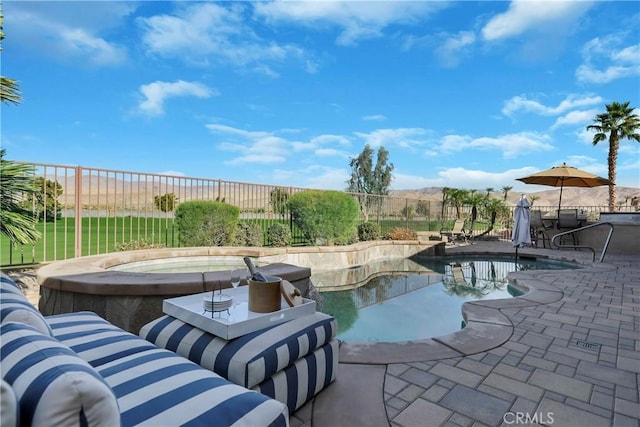 view of swimming pool with an outdoor hangout area, a patio, and an in ground hot tub