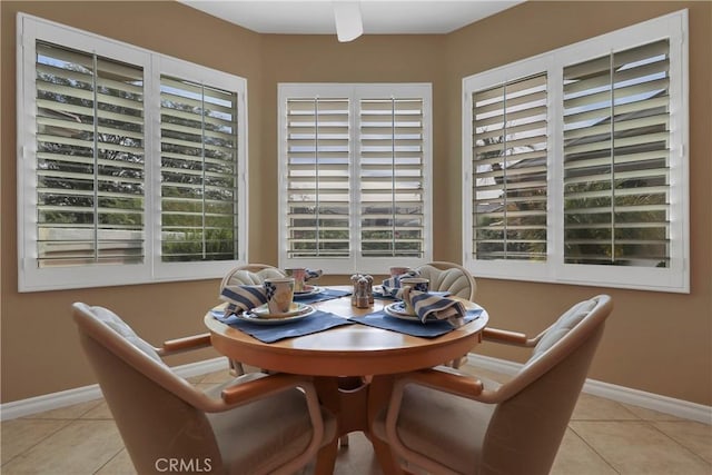 dining space featuring light tile patterned floors