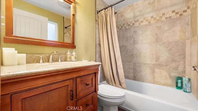 full bathroom featuring toilet, vanity, and shower / tub combo with curtain