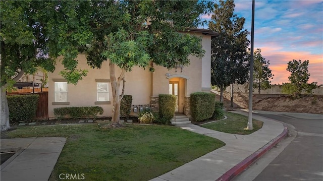 view of front of house with a yard