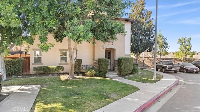 view of front facade with a front yard