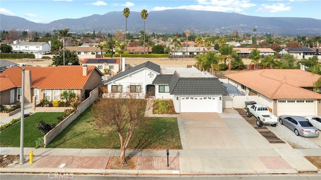 birds eye view of property with a mountain view