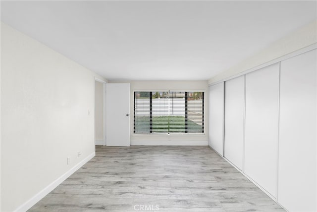 spare room featuring light hardwood / wood-style floors