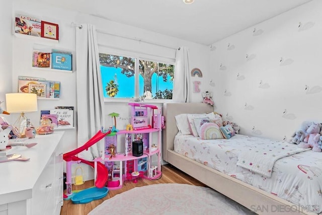 bedroom featuring hardwood / wood-style flooring