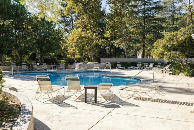 view of pool featuring a patio area