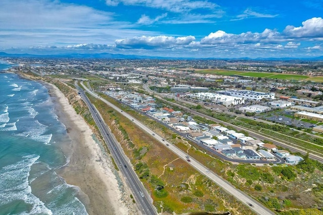 aerial view featuring a view of the beach and a water view